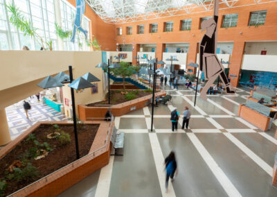 Interior view of Papageorgiou General Hospital with patients and visitors in a modern atrium