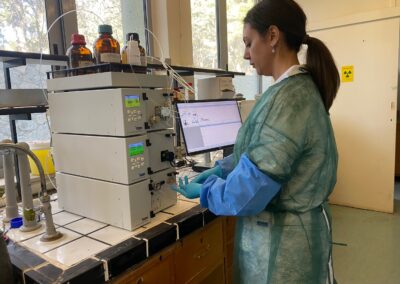 Researcher performing analysis at NCSR Demokritos laboratory