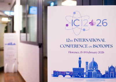 Poster of the 12th International Conference on Isotopes (ICI 2026) held in Florence, Italy, where the IFIGENEIA project was presented.