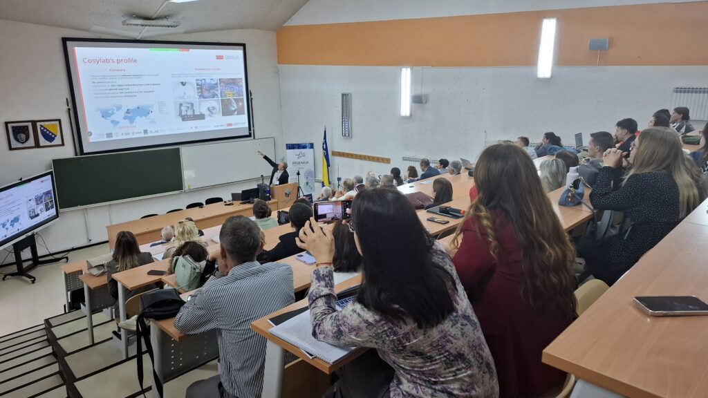 IFIGENEIA event in Sarajevo 2026 with a Cosylab presentation on particle accelerator solutions attended by participants in a university lecture hall.